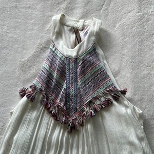 White flowy dress with colorful with colorful pattern on top